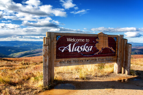 iStock-945606898-500x333 Alaska, USA: Welcome to Alaska sign at Canadian border on Top of the World Highway